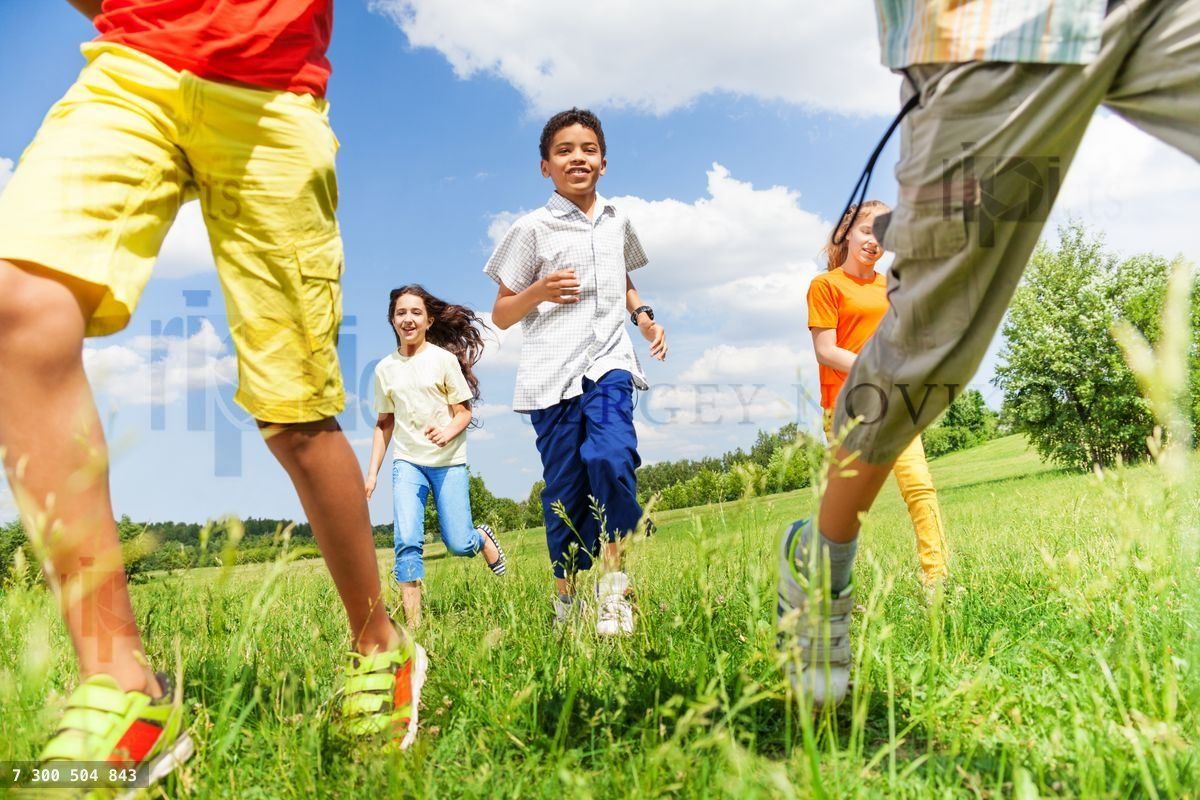 Running kids together playing outside