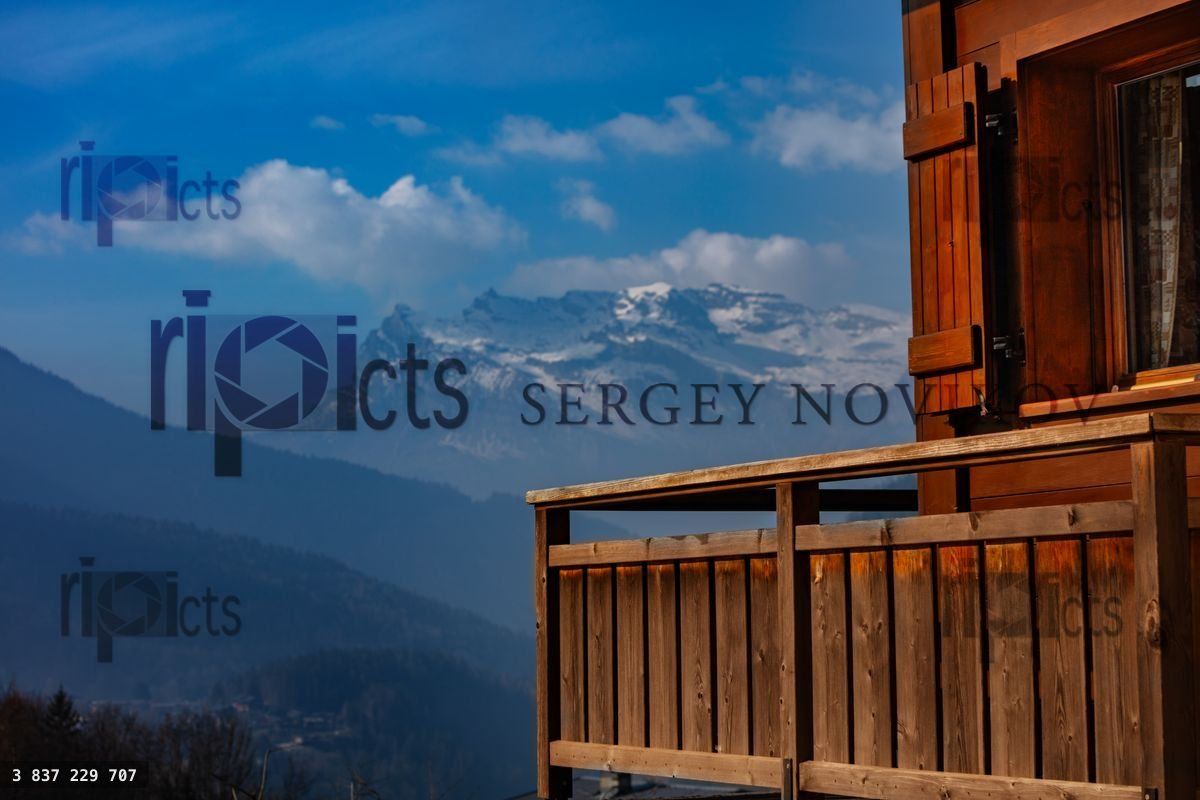 French mountain landscape with wooden balcony on foreground