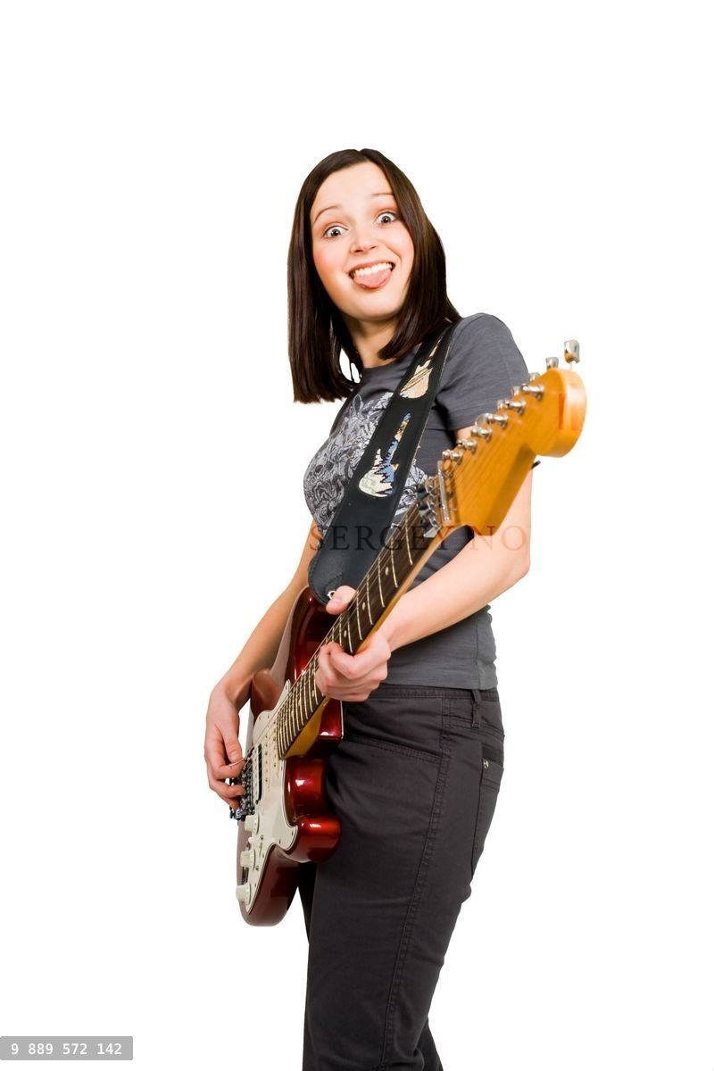 Woman playing on electric guitar