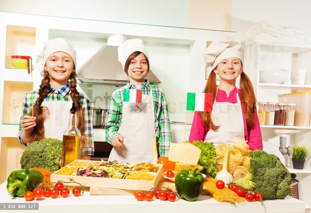 Young cooks preparing traditional Italian meal