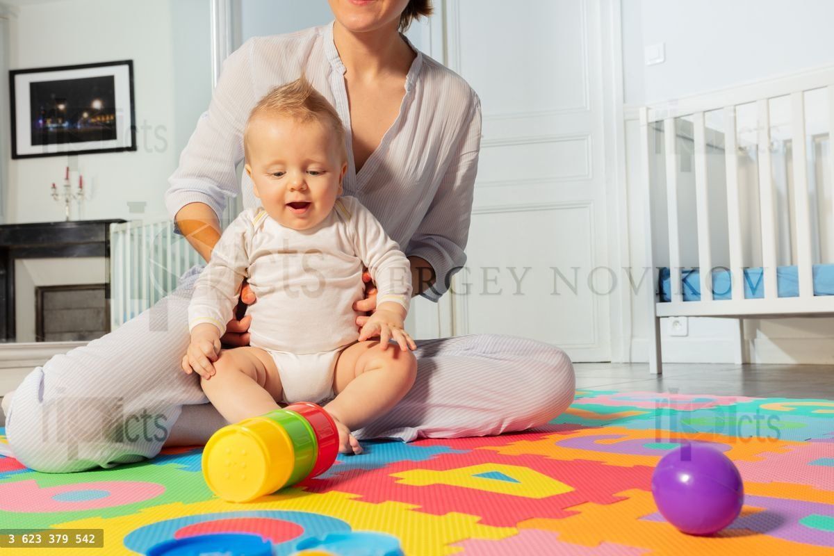 Young mother play and interact with toddler boy
