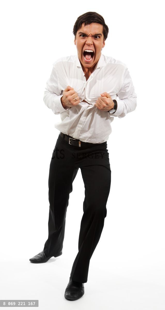 Frustrated business man tearing apart his shirt