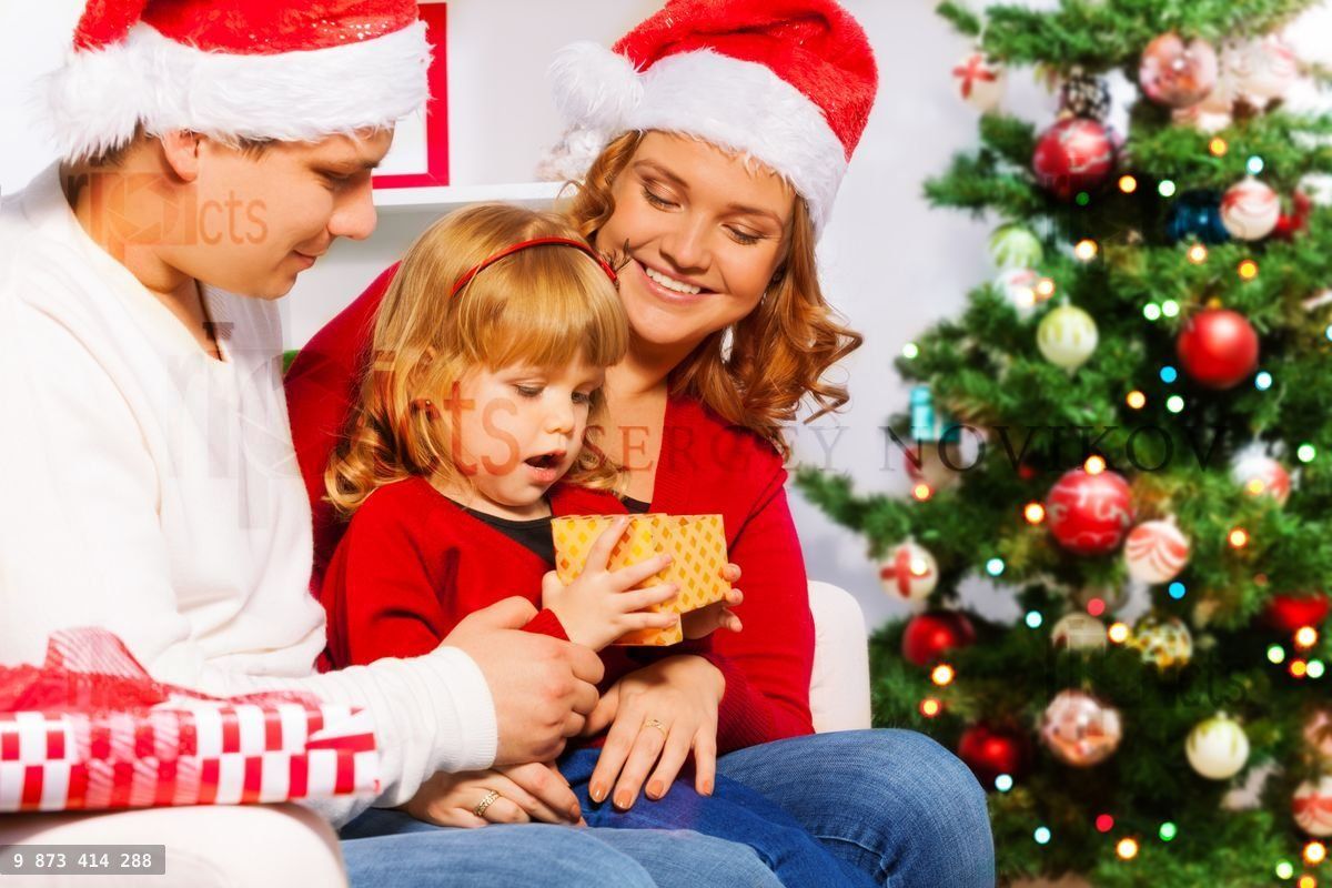Mom and dad give New year presents to happy girl