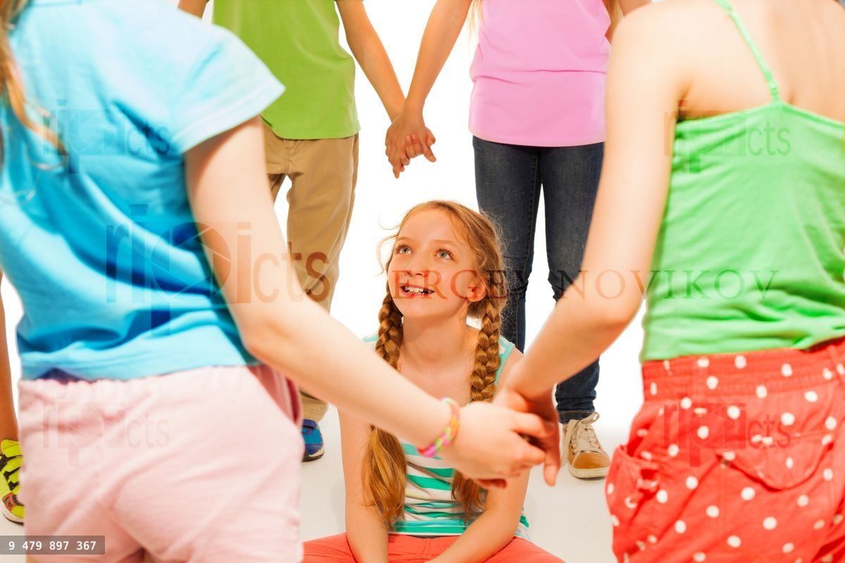 Kids play a game, girl sit in the circle