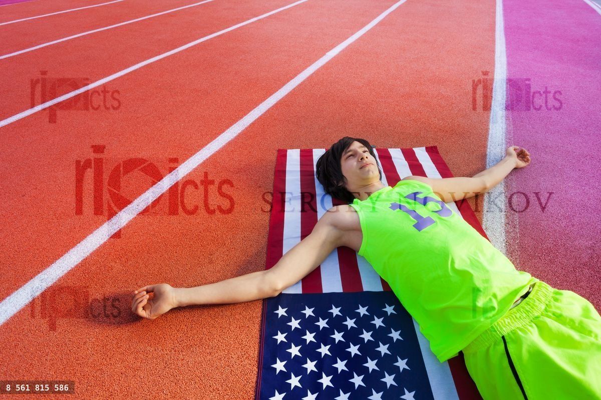 Happy American athlete having rest after marathon