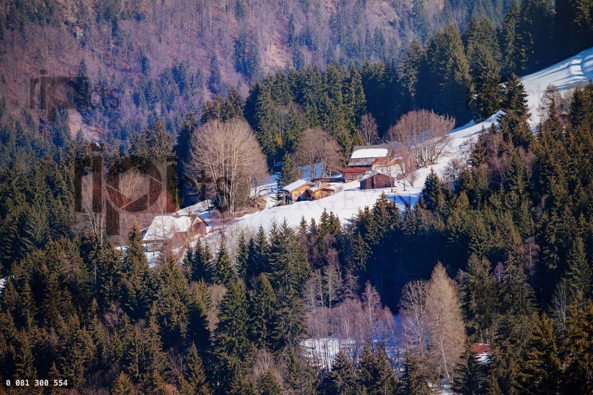 French mountain landscape many chalets on Alps slope at winter