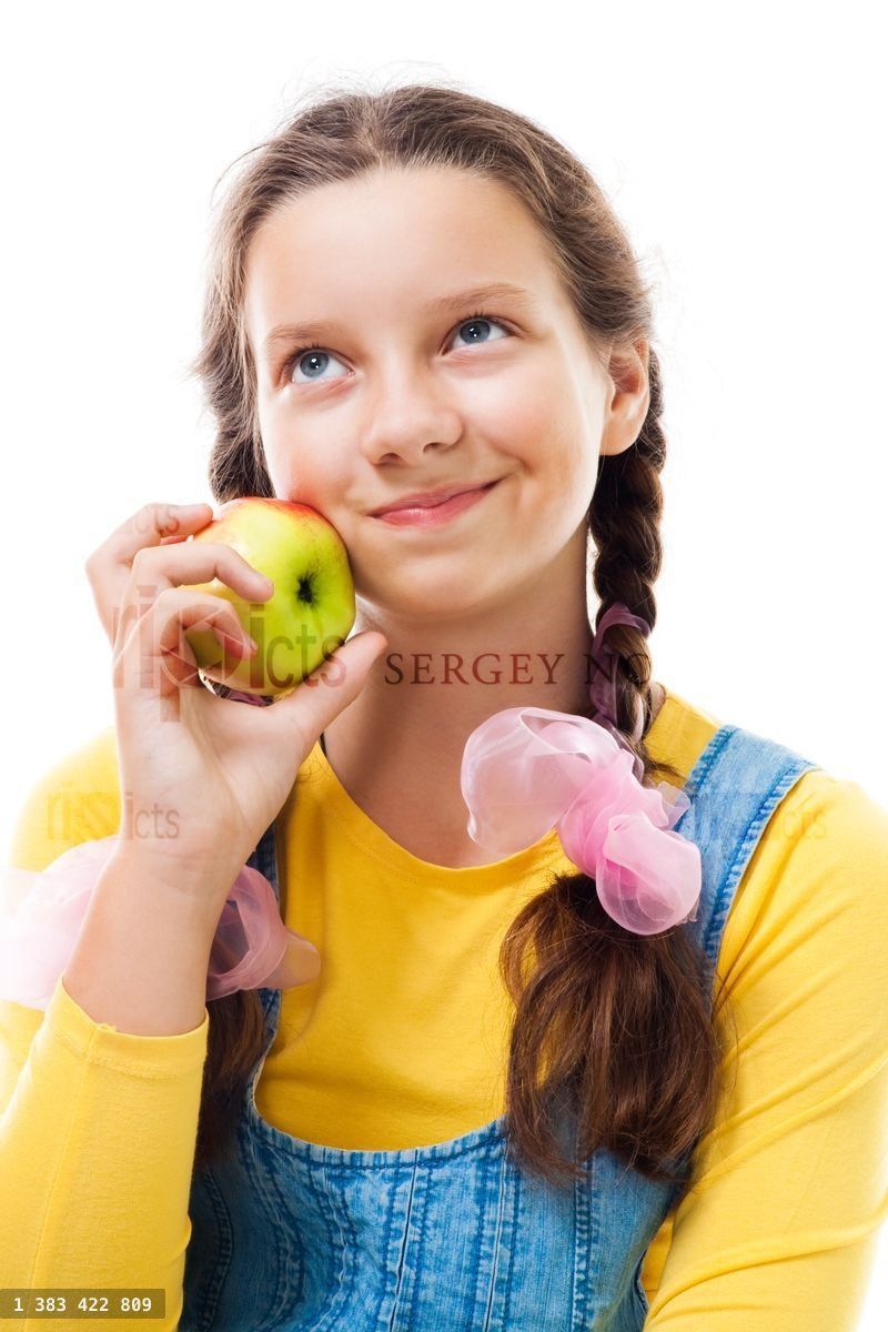 young teenager girl with apple standing