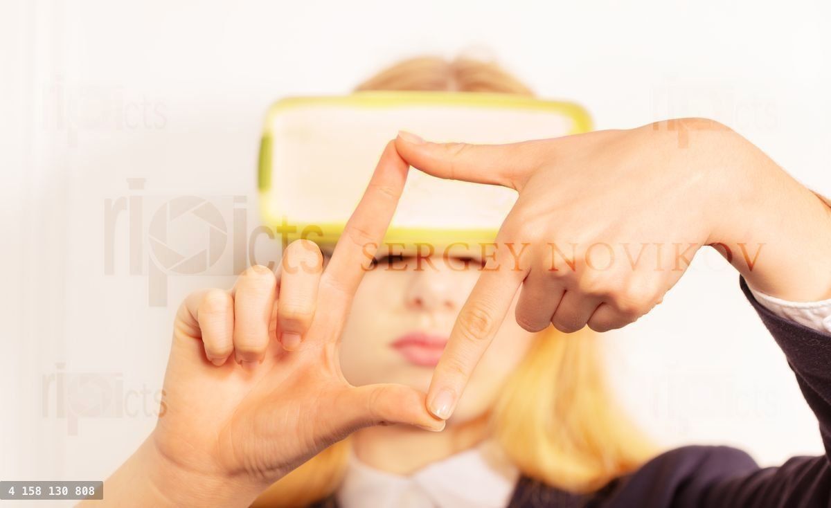 Woman in virtual reality glasses take a photo