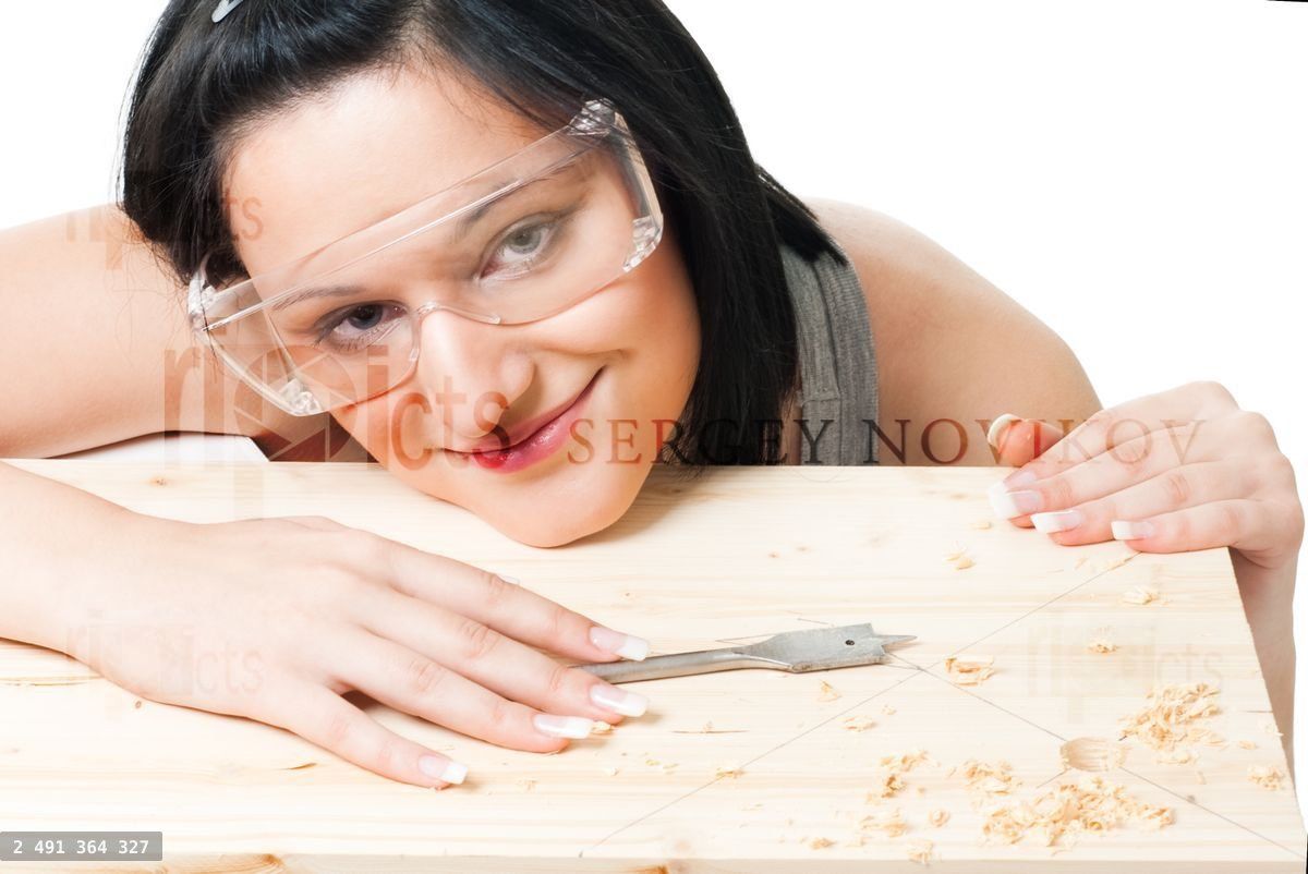 Woman with drill for wood
