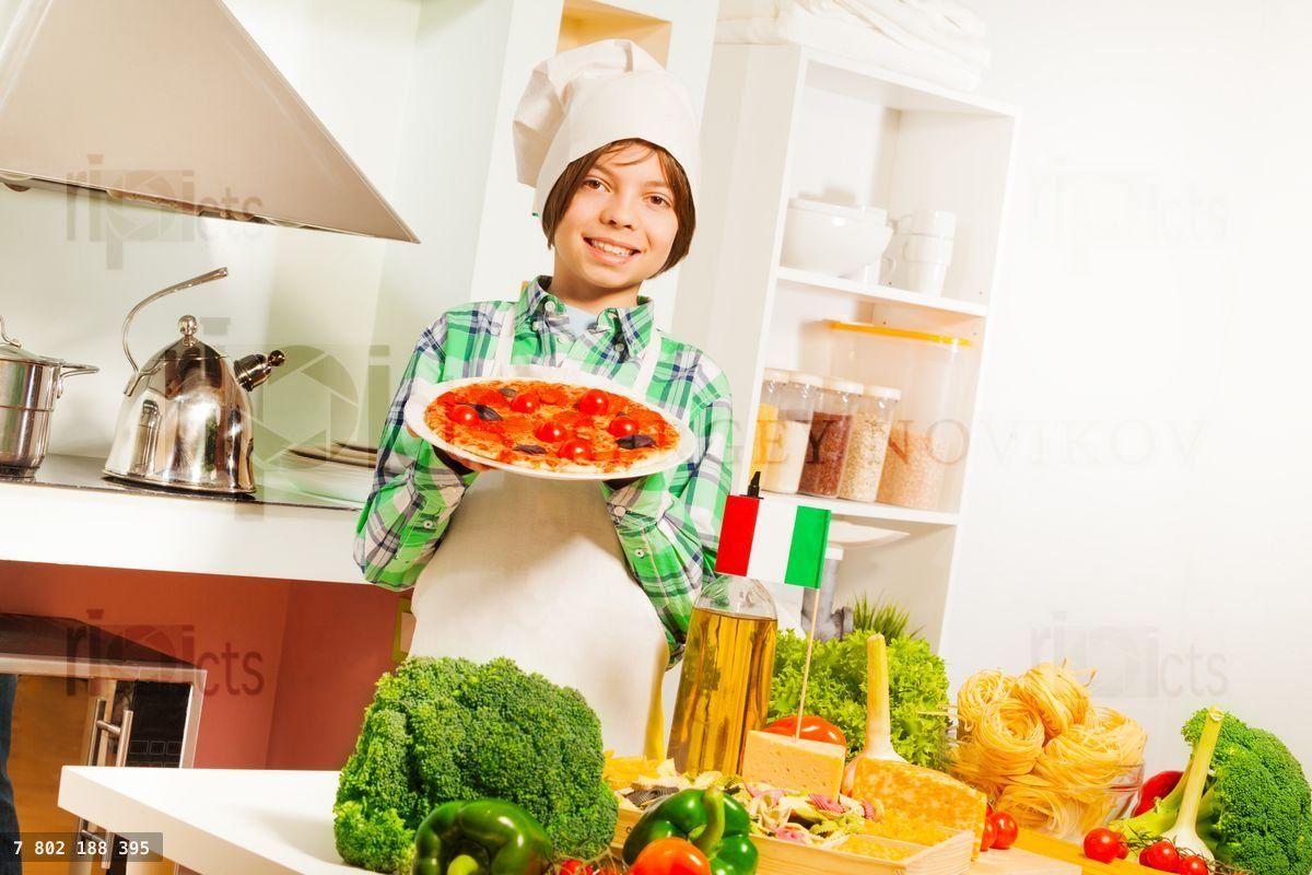 Young boy demonstrates traditional Italian cuisine