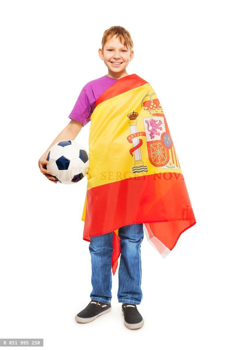 Boy with soccer ball wrapped in a Spanish flag