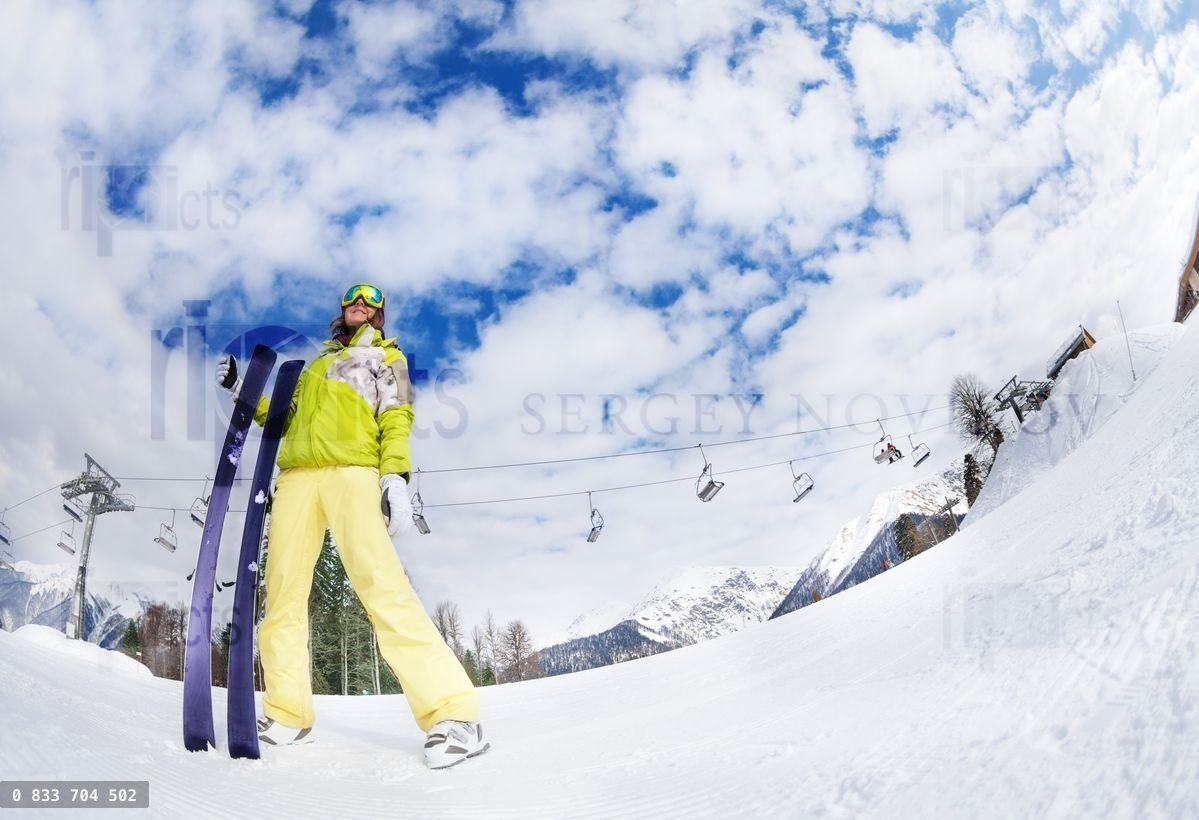 Young woman in mask holding ski fisheye view