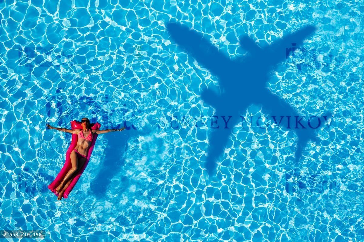 Woman swim on inflatable matrass in the pool