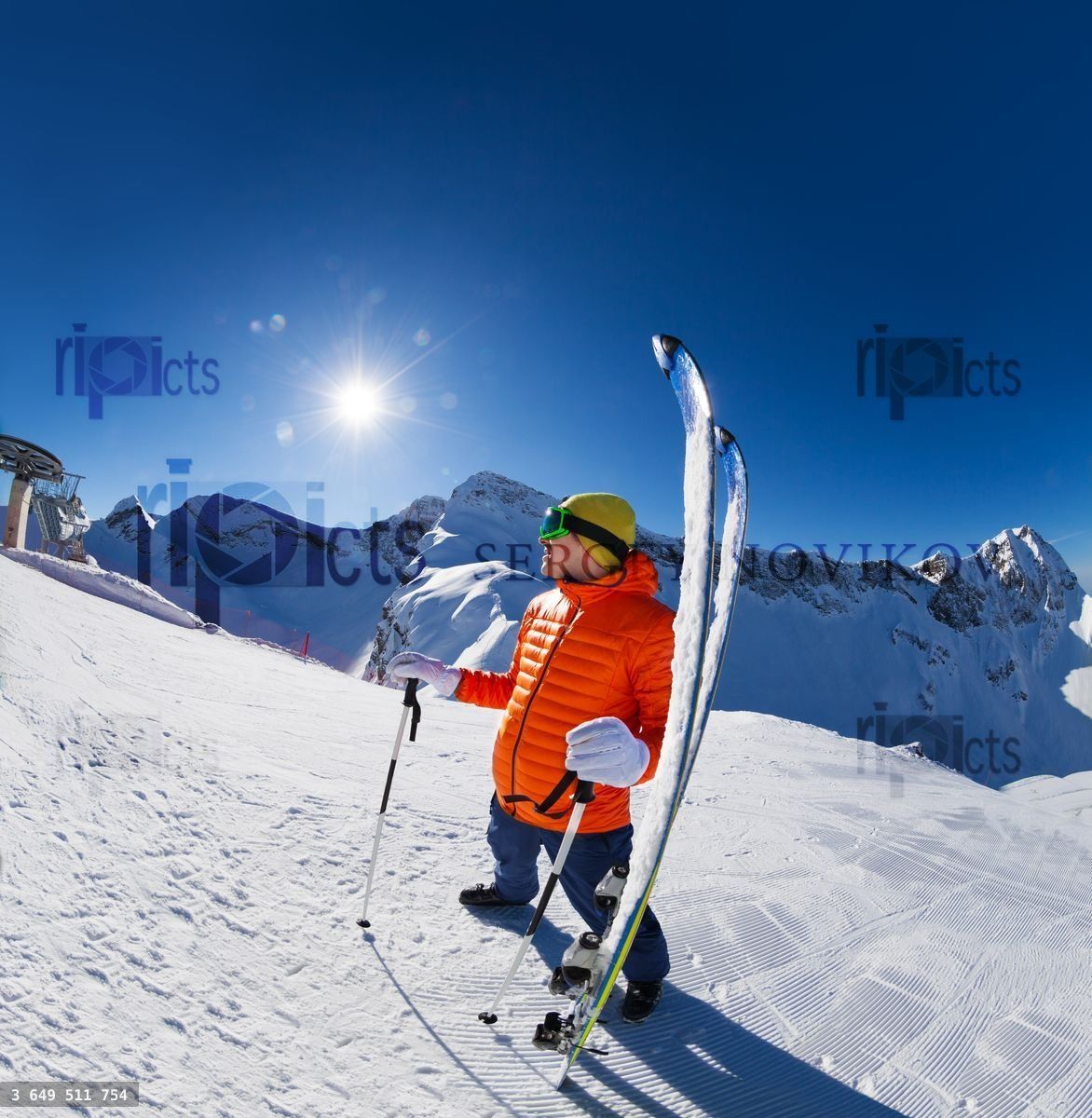Young man standing with ski near in snow