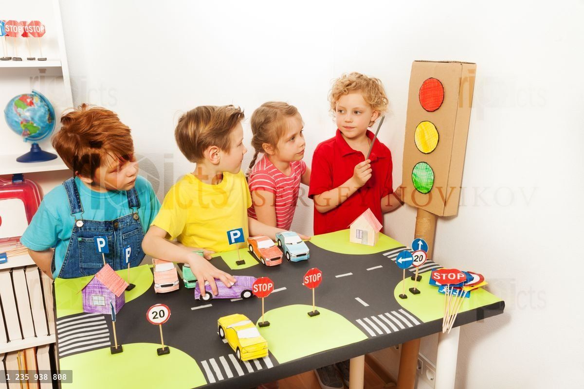 Four kids studying Highway or Traffic Code