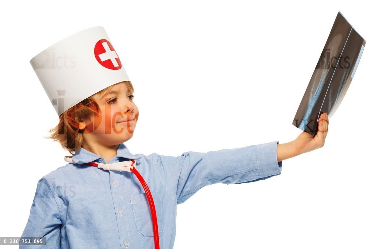 Young doctor studying an x ray of hand