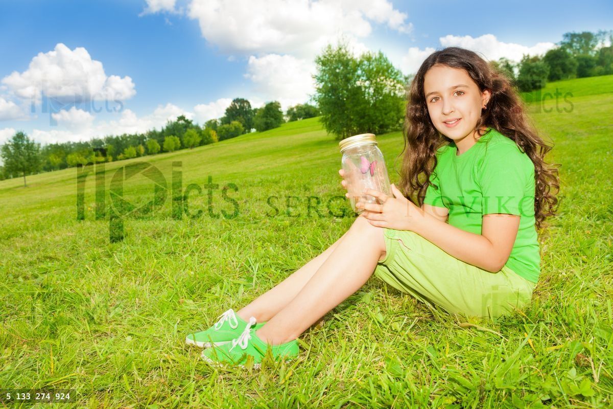 Girl hold jar with butterfly