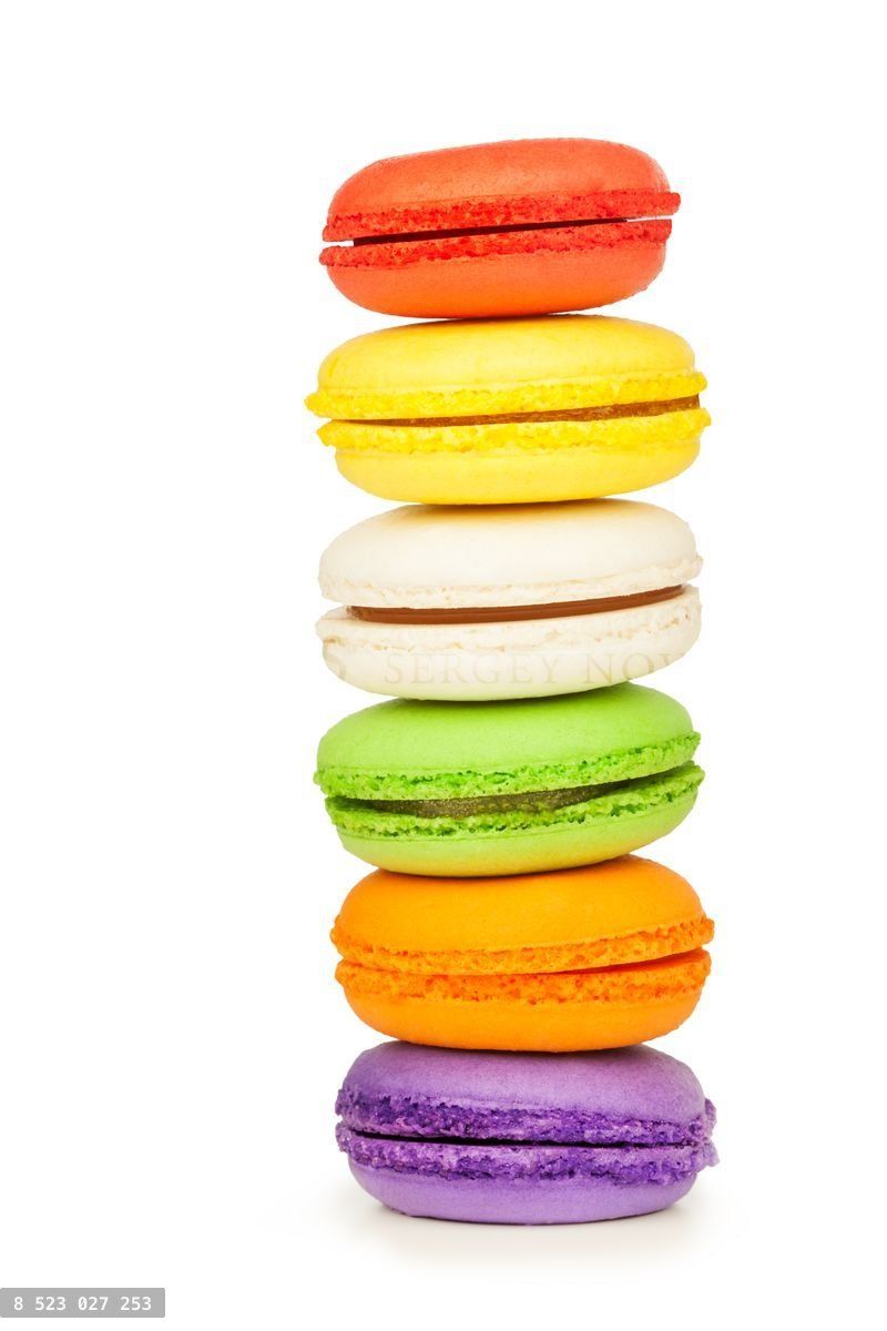 French colorful macarons isolated on white