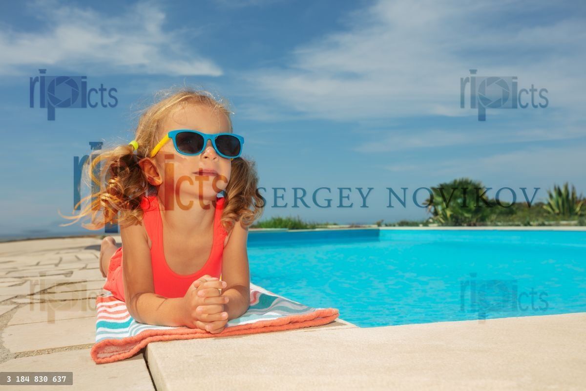 Young girl enjoys pool day with sunglasses, lay down on edge