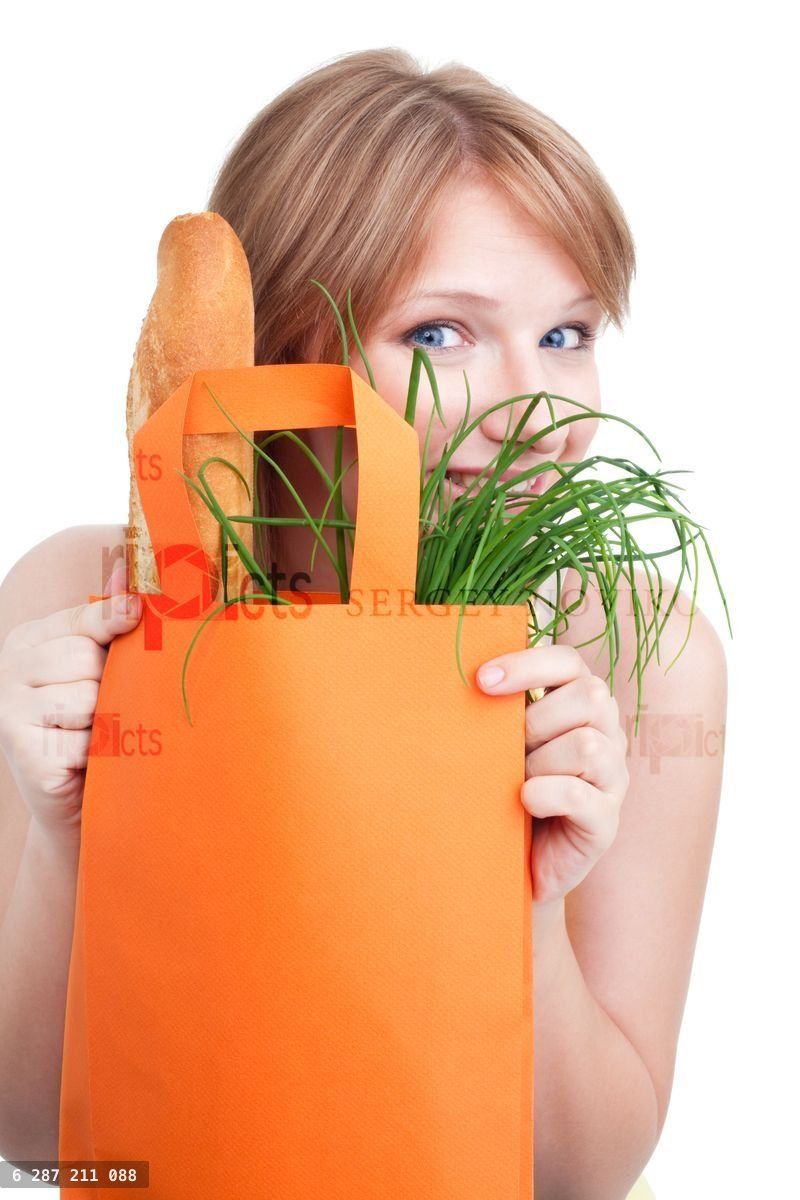 Woman hiding behind shopping bag