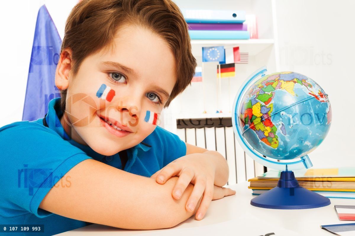 French boy learning geography with the globe