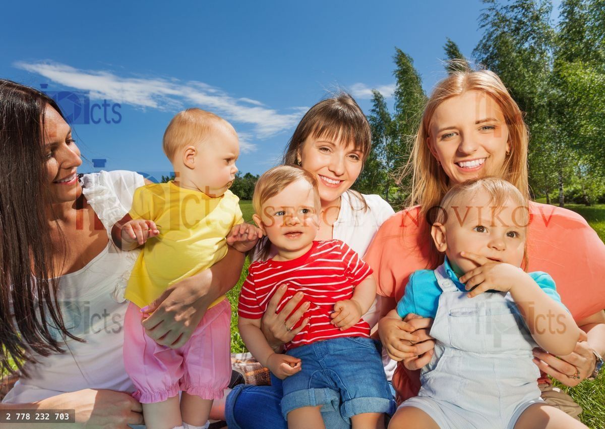 Close up of happy mothers holding cute babies