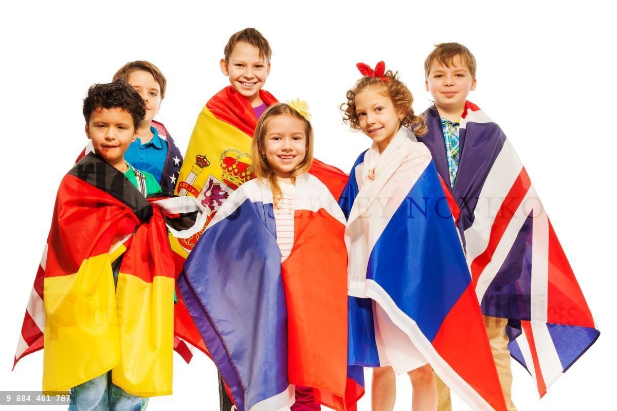 Group of kids wrapped in European nations flags