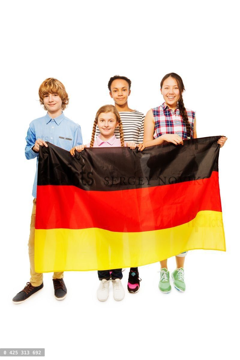 Four multiethnic teenage kids holding German flag