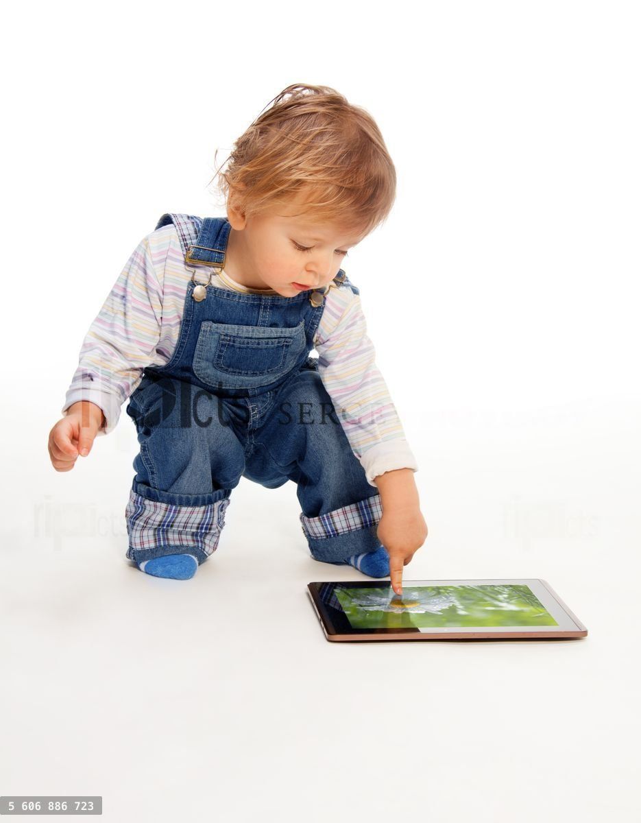young kid touching tablet pc