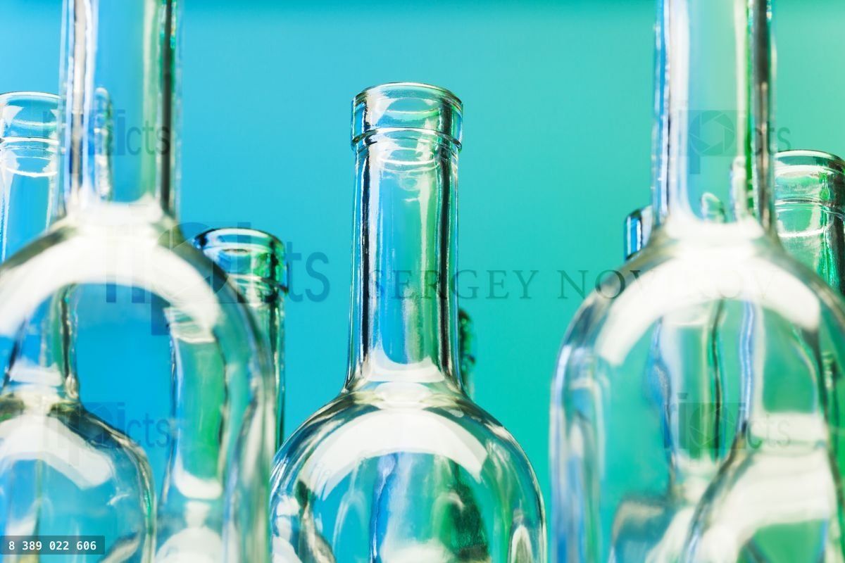 Crystal bottlenecks of empty glass wine bottles