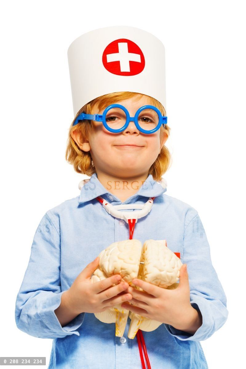 Young boy with medical cap and cerebrum dummy