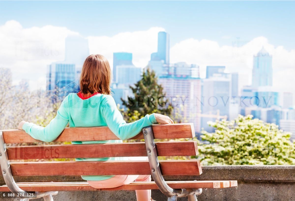 Young woman in Seattle park look at downtown