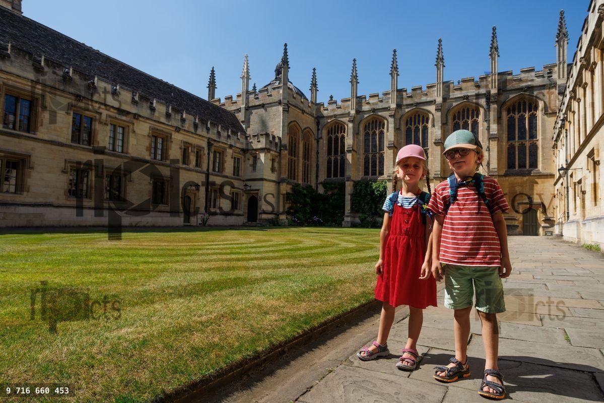 Young siblings enjoy All Souls College, Oxford, Great Britain