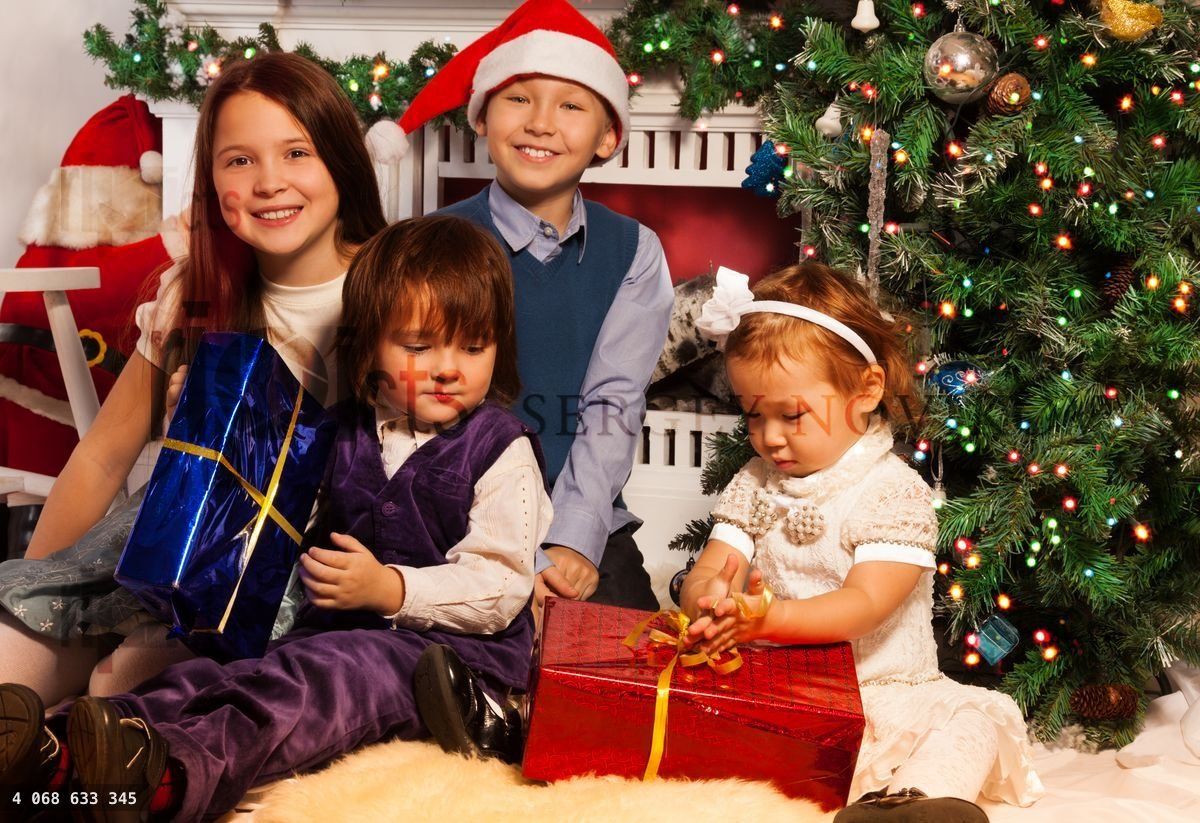Four kids sitting side by side to fireplace