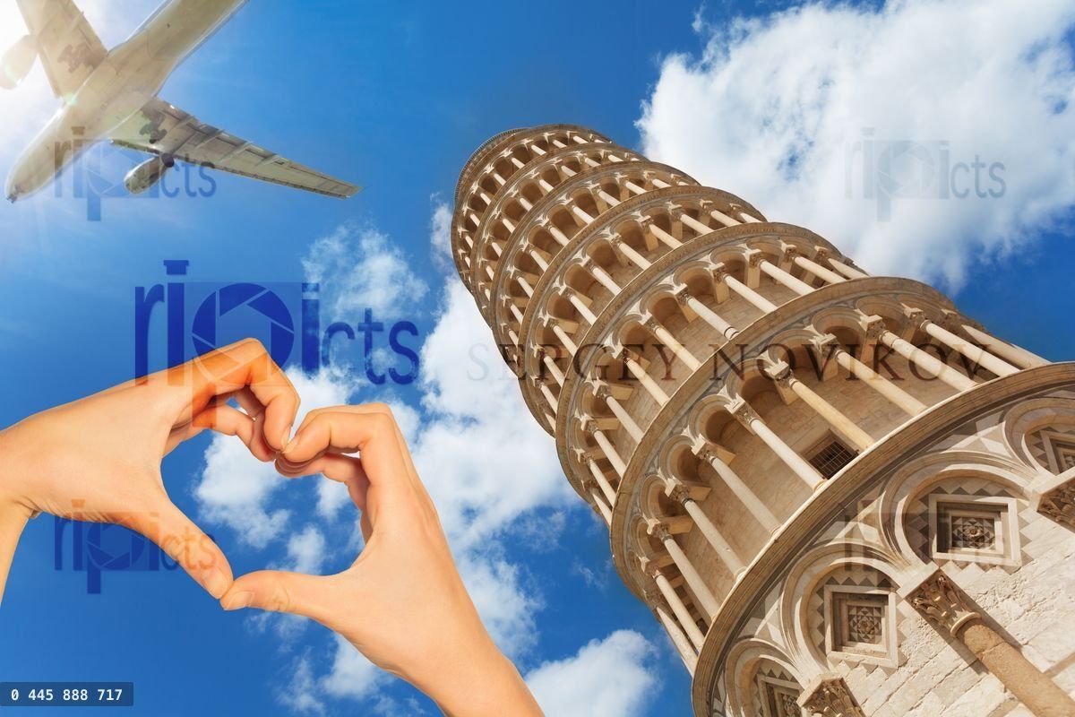Hand hold red heart over Pisa tower and airplane