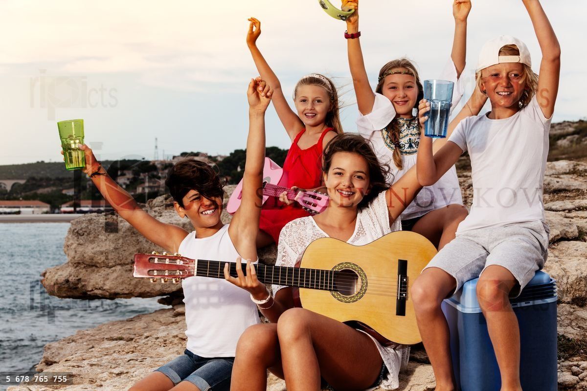 Young band playing music at outdoor picnic