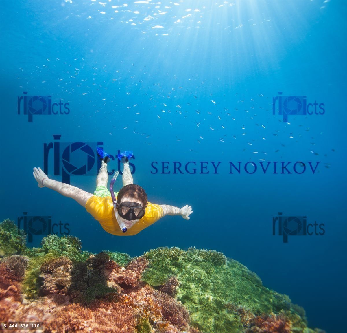 Young explorer snorkeling underwater