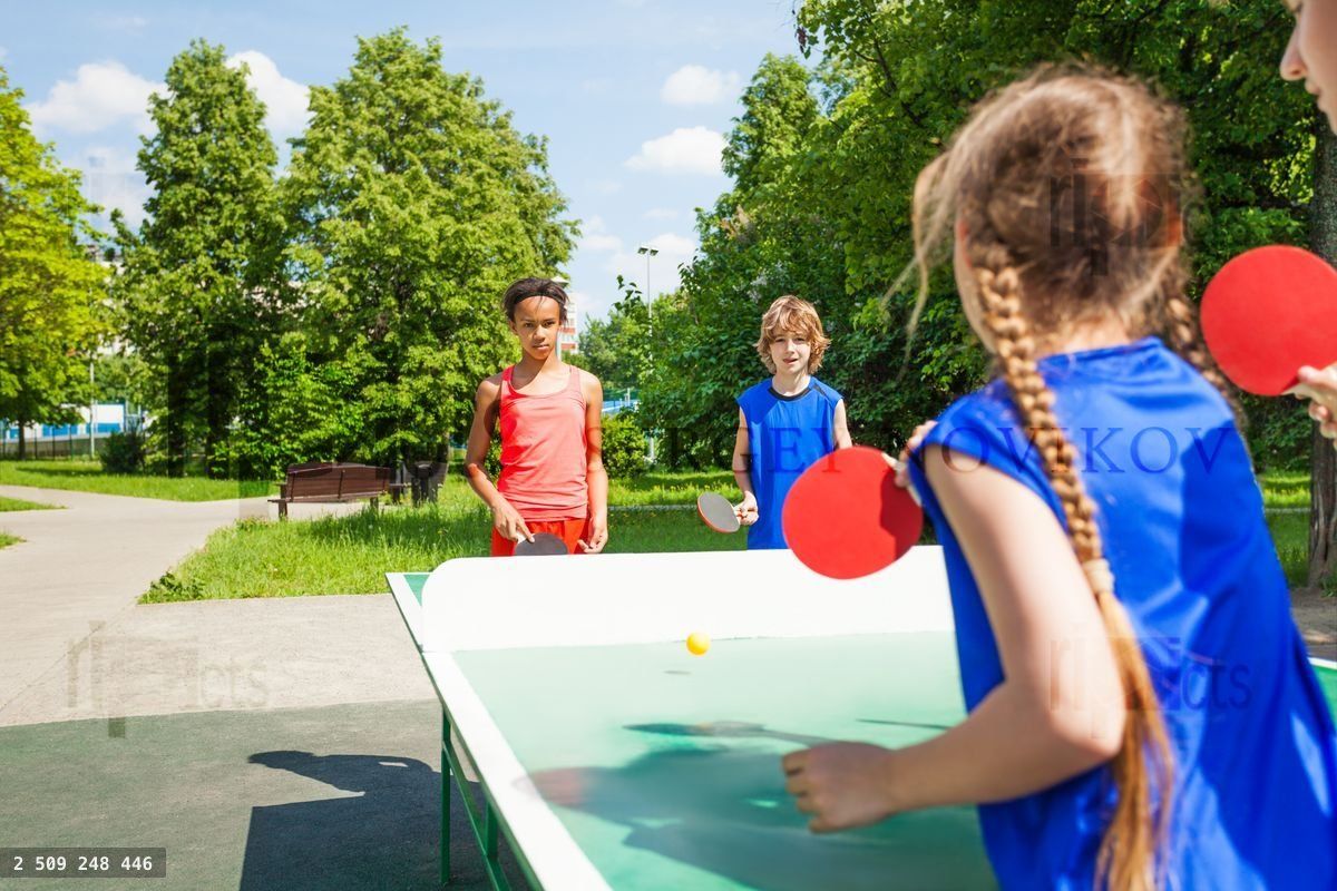 Four international friends play table tennis