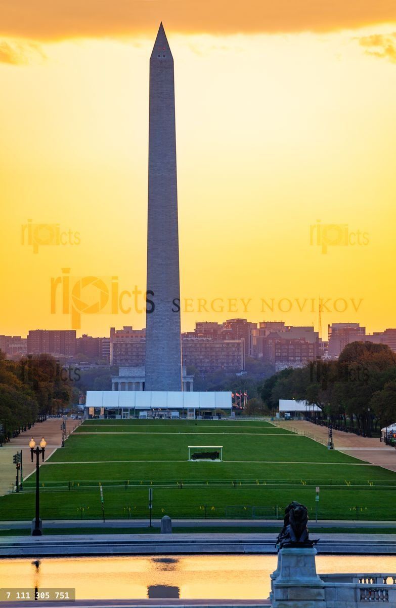 George Washington Monument obelisk over sunset sky
