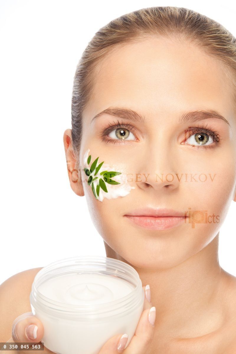 Beautiful women applying moisturizer cosmetic cream