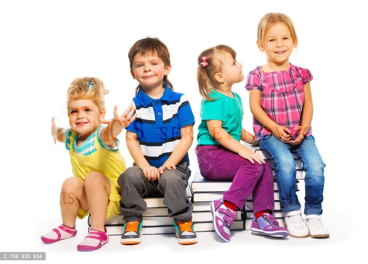 Group of kids sitting on the books stack