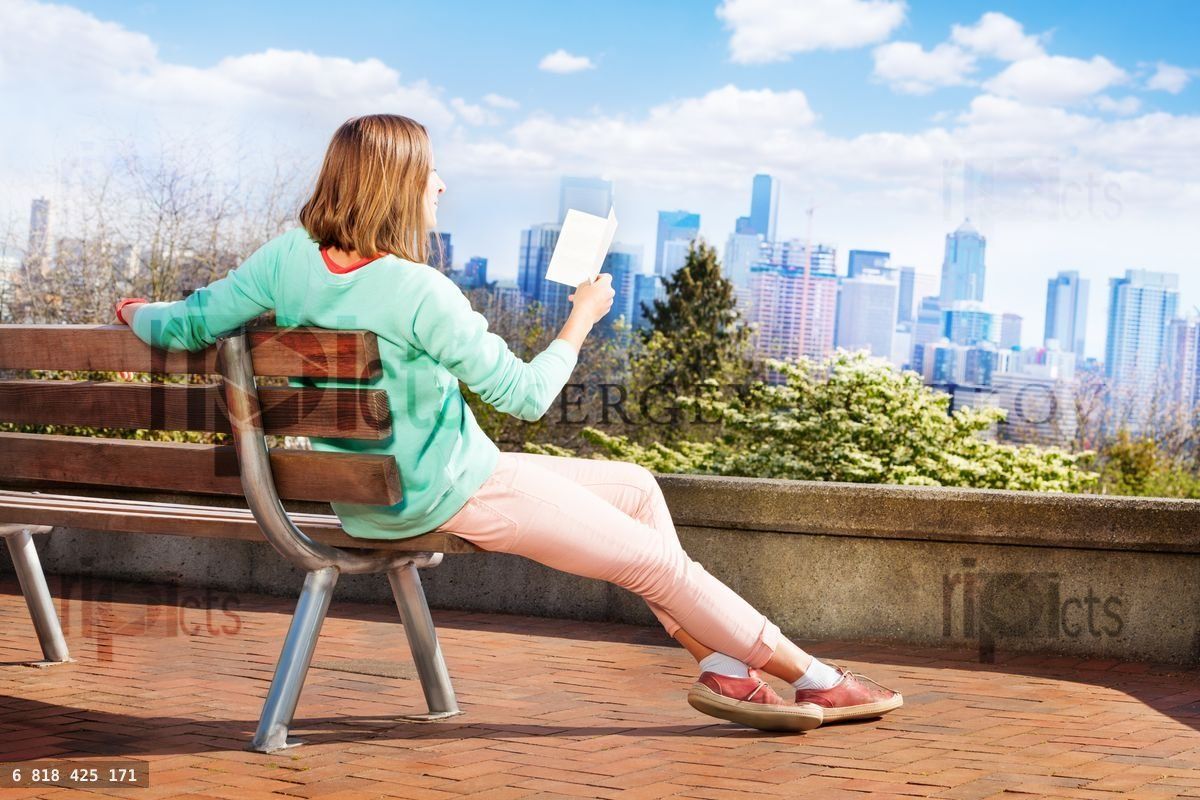Woman read book in Seattle park