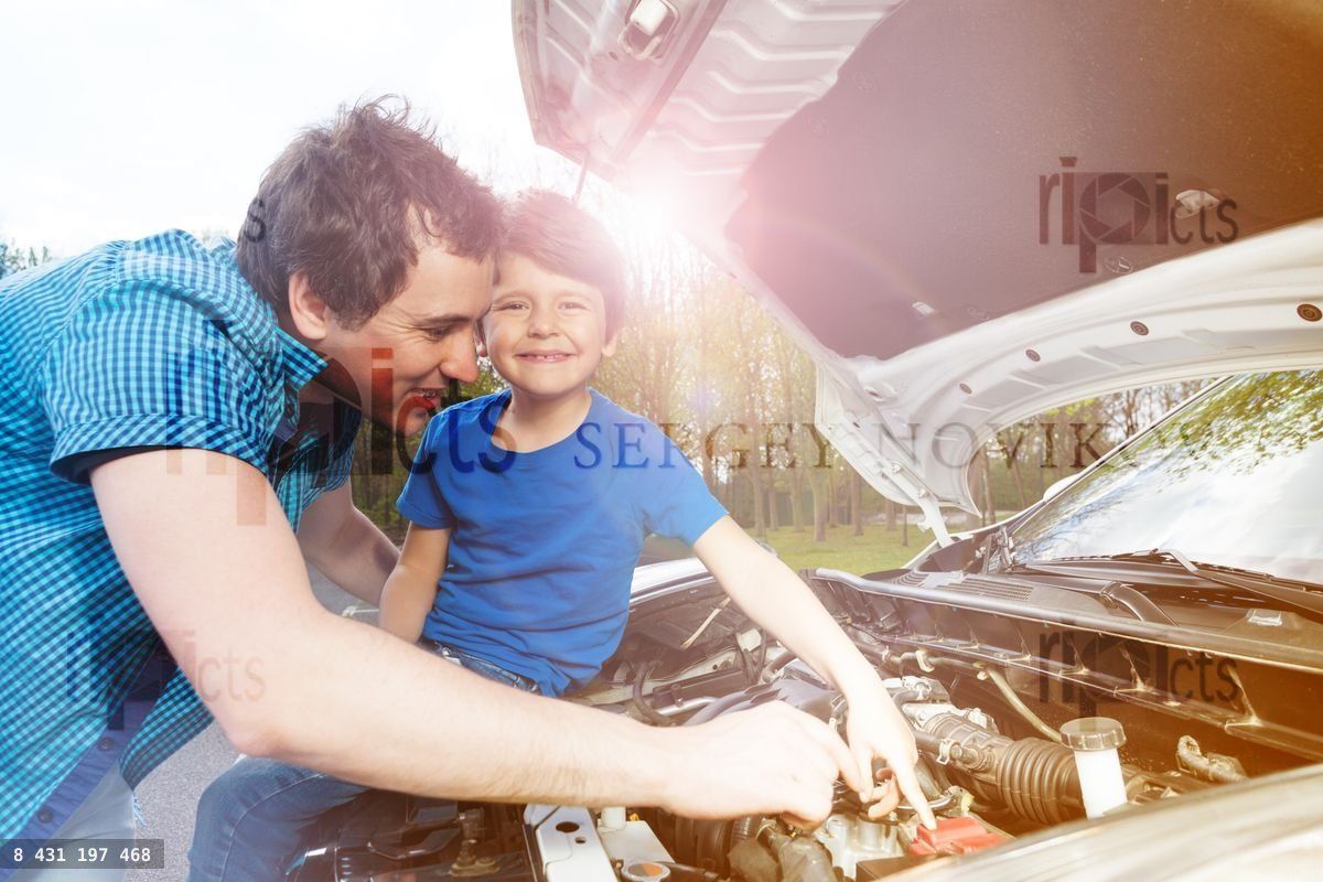 Young father teaching his little son repairing car