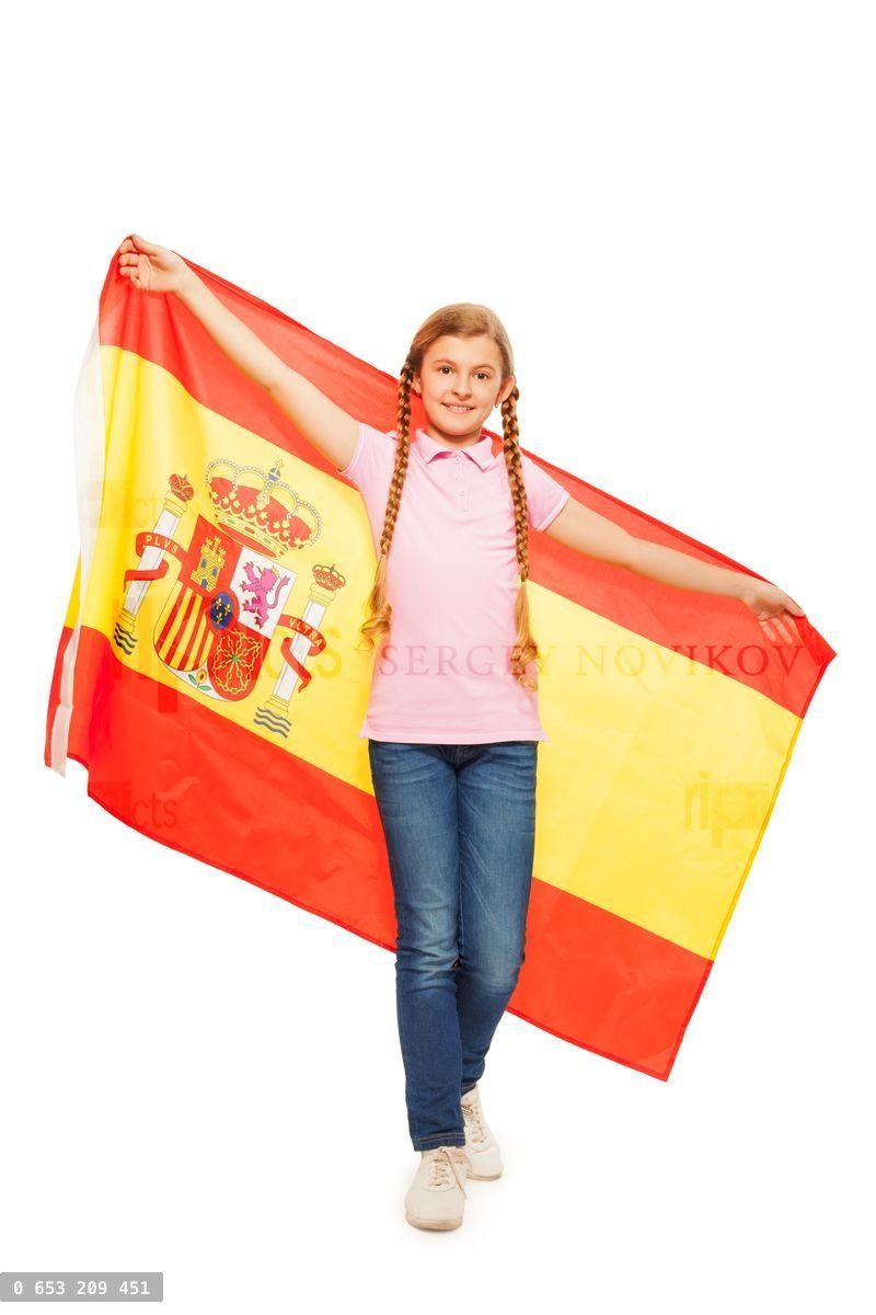 Young girl holding unfolded flag behind her back