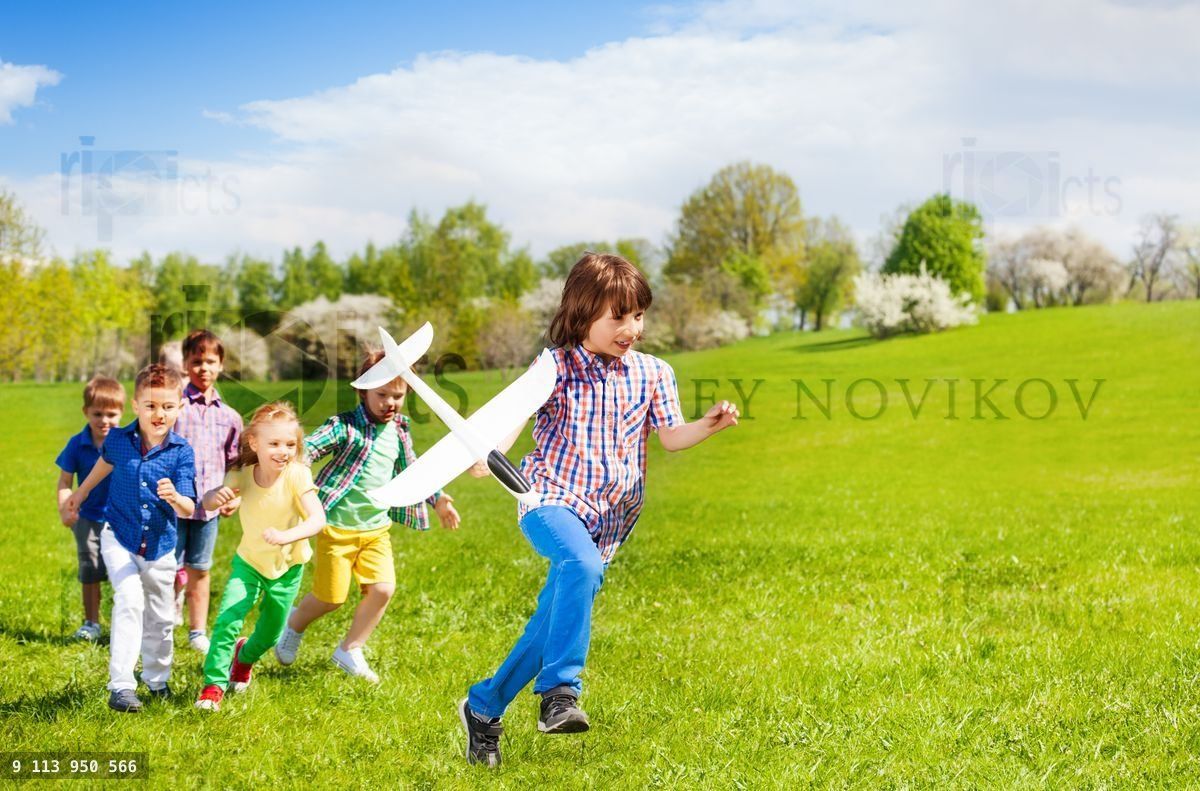 Happy running children with big white airplane toy