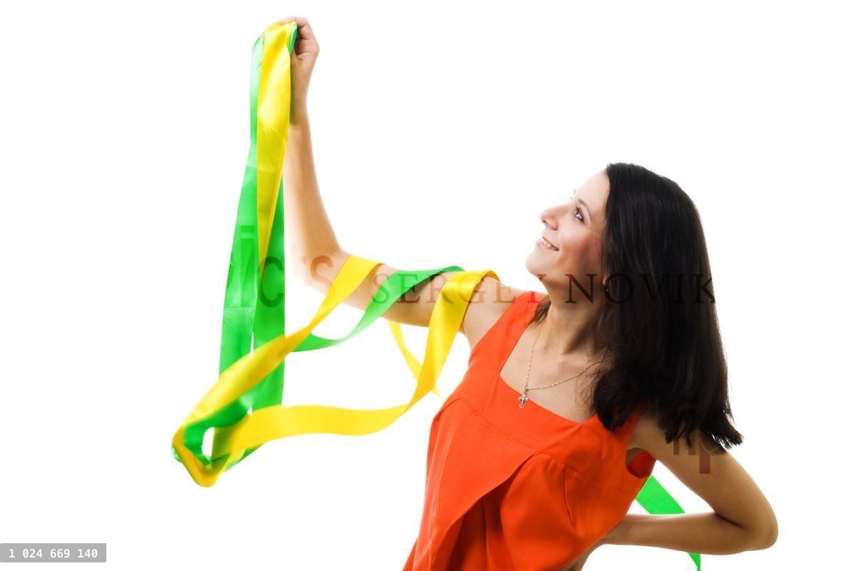 Woman in orange dress with flying ribbon
