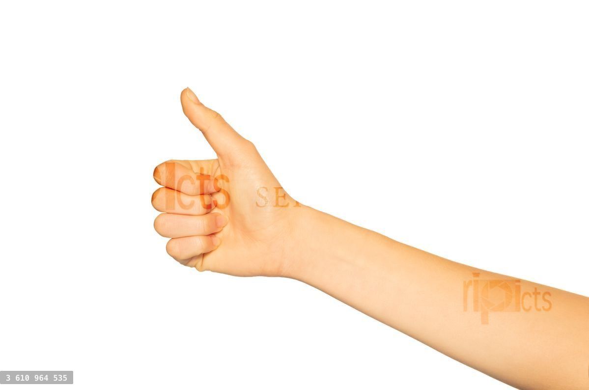 Woman's hand giving thumbs up gesture on white