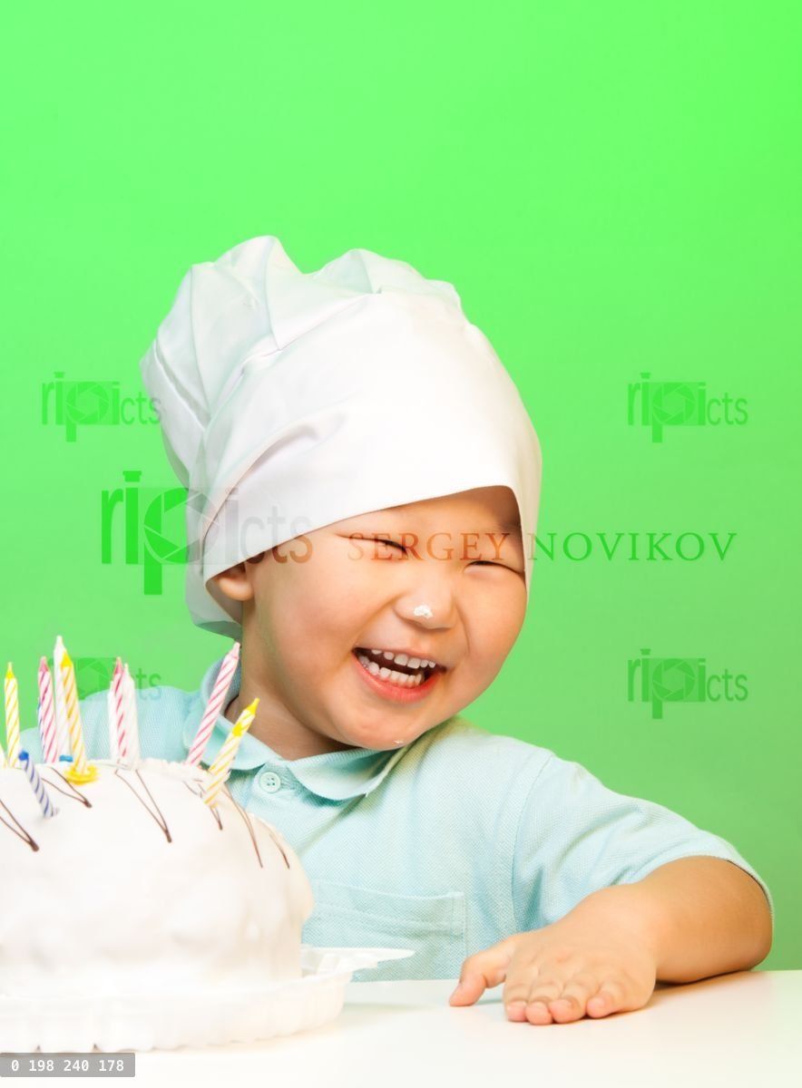 Happy boy with just cooked cake
