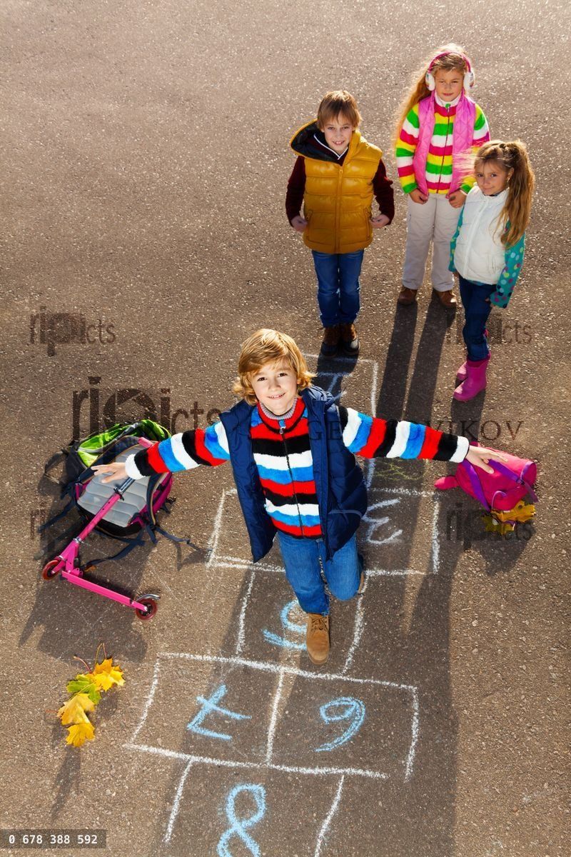 Friends jump on drawed hopscotch