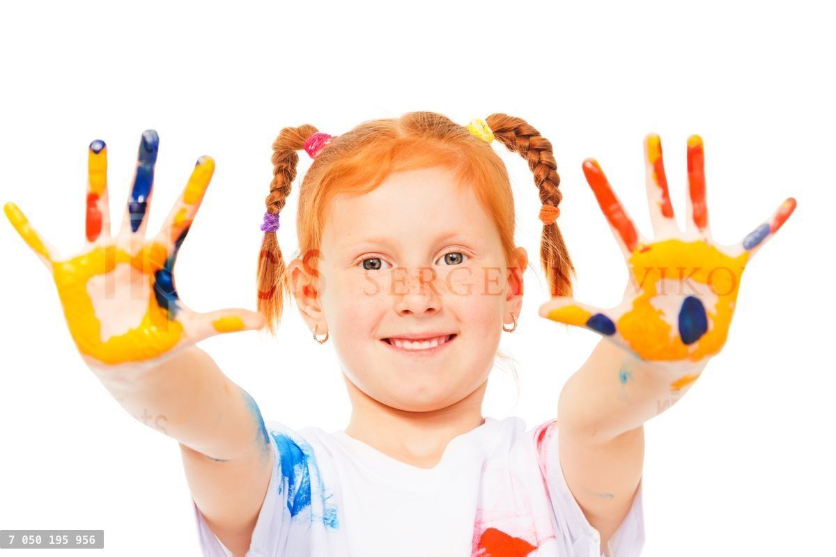 Funny little girl shows her painted palms